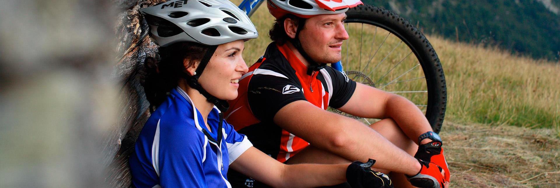 Two cyclists are taking a break